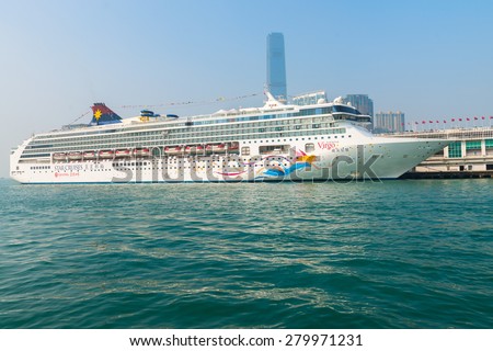 HONG KONG, CHINA - 18 JAN 2015: A luxury cruise liner, the Superstar Virgo from Star Cruises, moored and waiting for passengers at the central pier in Kowloon.