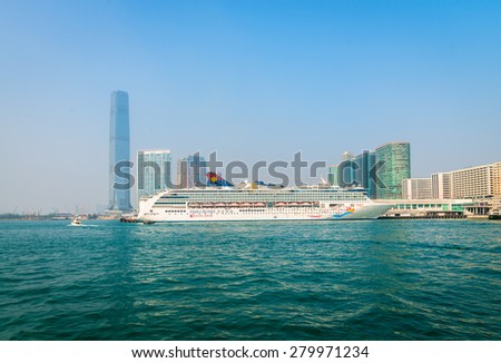 HONG KONG, CHINA - 18 JAN 2015: A luxury cruise liner, the Superstar Virgo from Star Cruises, moored and waiting for passengers at the central pier in Kowloon.