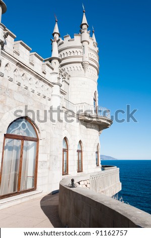 Fantastic castle: Swallow\'s Nest Castle tower, Crimea, Ukraine, with blue sky and sea on background