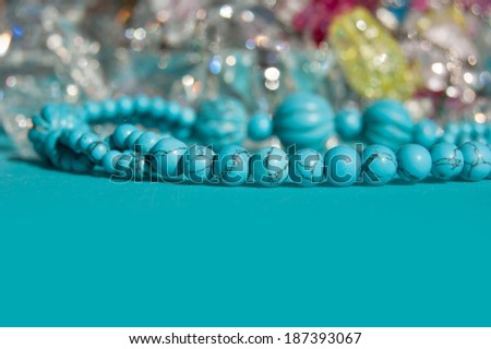 Jewelry background. bijouterie on the aquamarine background. Turquoise.