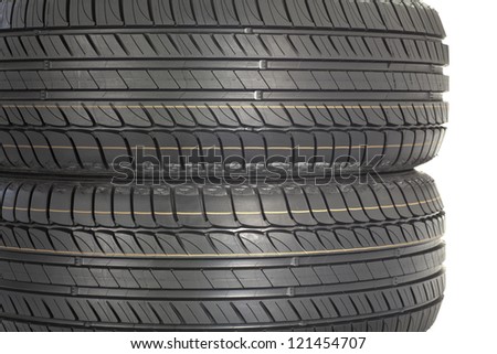 Stack of new tires. Brand new tires stacked up, isolated on white background