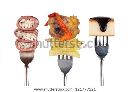 Food on shiny forks. Food on forks, on white background. First course, main course and dessert.