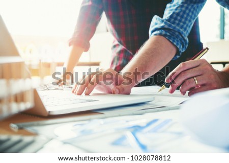Architect or engineer meeting in office on blueprint And model building. Architects workplace