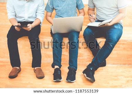 University students using laptop meeting for research homework in college