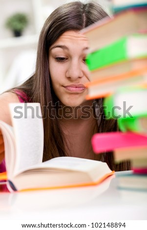 Young girl unhappy about having too much to study