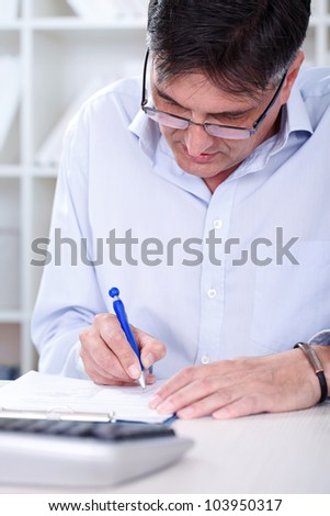 Man Sitting Writing