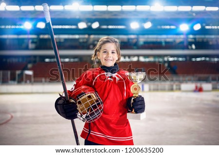 happy youth girl player ice hockey winner trophy