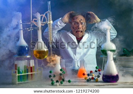 scientist pulling his hair for because of a failed experiment