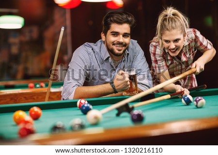 billiard game- smiling couples playing pool game