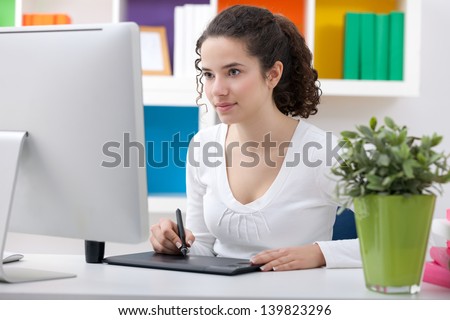 Graphic designer working using pen tablet