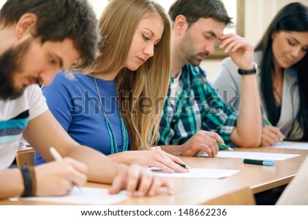 Young Students Having A Test In A Classroom
