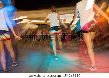 Young active people dancing in gym, fitness dance class