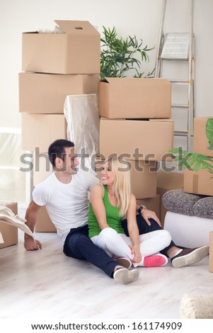Young couple resting from moving into a new home.