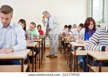 Senior Teacher With Class In A Classroom