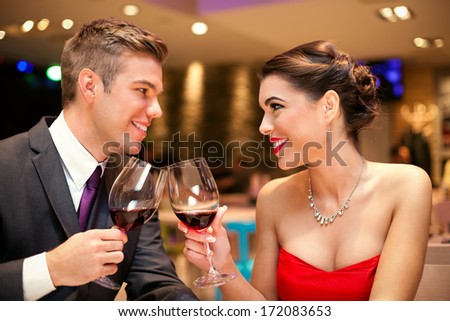 Love Couple Looking Each Other And Toasting