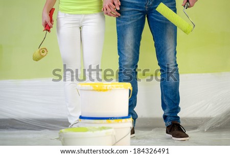 Couple with equipment for painting