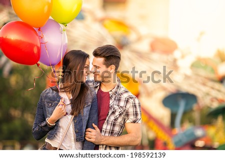 Romantic couple in the amusement park