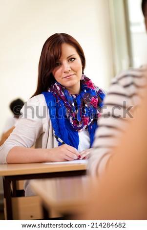 Young female university student in classroom