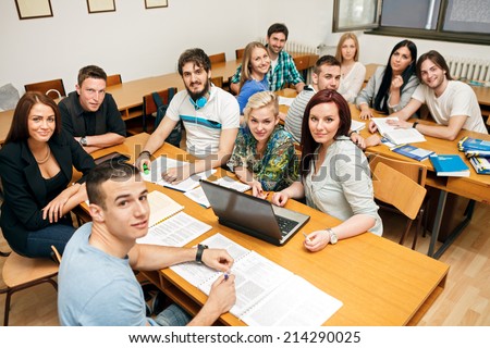 Happy students in a classroom in university class