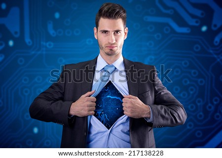 businessman as super hero with electrical circuit under the shirt