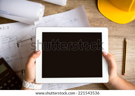 tablet architecture equipment with work tool on wooden desk