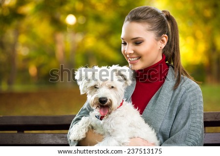 beautiful woman and his dog maltezer in autumn in autumn