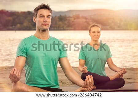 serene people doing yoga, outdoor