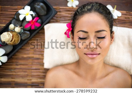 Balinese woman relaxing in spa salon smiling relaxing with eyes closed