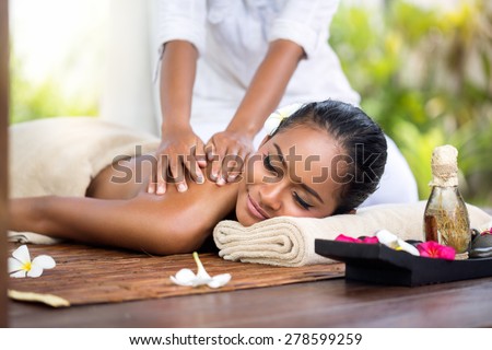 Woman in a day spa getting a deep tissue massage of back  therapy