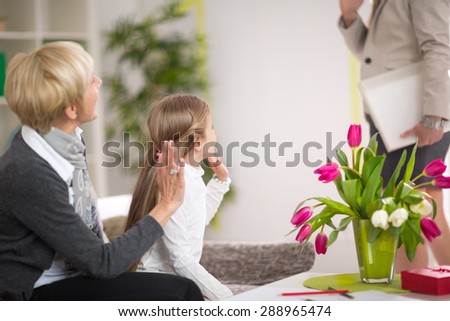 Girl greeting her mother and stay at home with her grandmother, gesture, happiness, generation, home and people concept