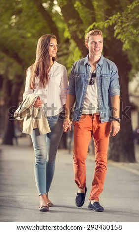Stylish couple in love  walks in the park