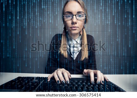 Nerd girl  using a computer with binary code on the screen