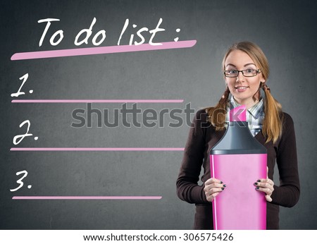 Beautiful teen girl with big marker  and to do list