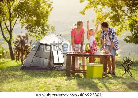 young happy family on vacation in nature
