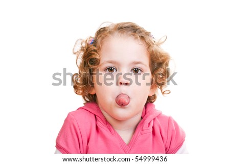 stock photo closeup of a naughty little girl sticking out tongue