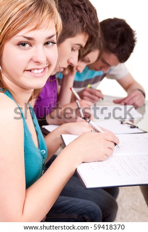 closeup of a young student studying with her friends