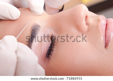 Young Caucasian woman get a injection, close up