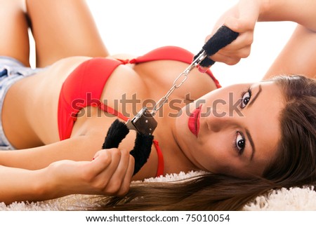 stock photo Hot naked brunette with handcuffs