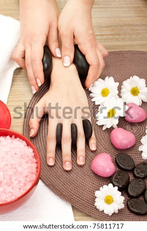 beauty therapist hands massaging hands or manicure