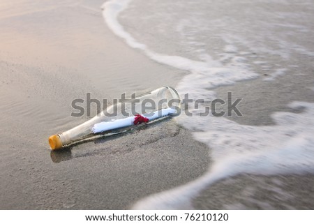 love message in glass bottle on the beach