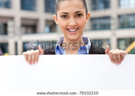 business woman holding blank paper for advertisement
