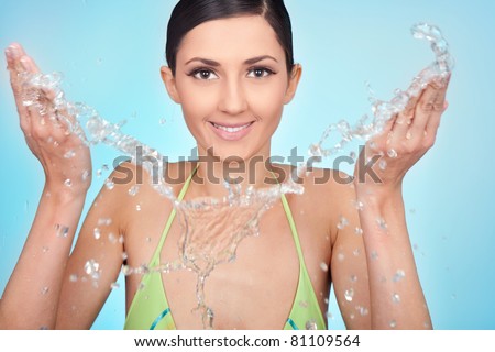 washing face, smiling portrait of a beauty female wash her face with water