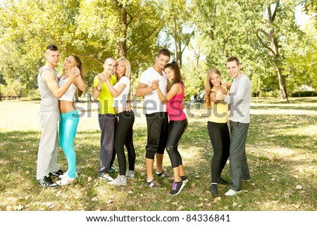 four couple dancing in park, free time