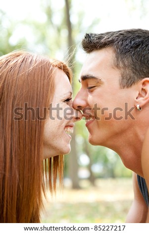 smiling couple touching noses, romantic kiss