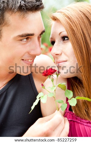 men giving flower her girlfriend
