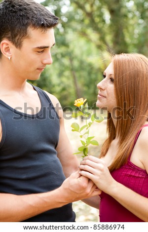boyfriend giving flower his girlfriend