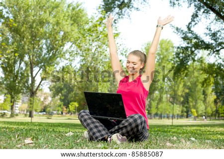 happy,  beautiful woman with laptop on nature