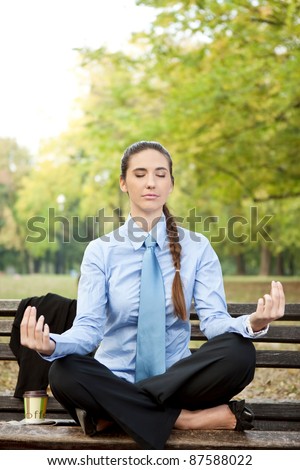 Woman in business wear relaxing in nature