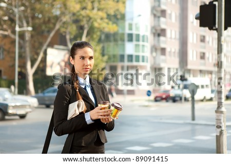 young businesswoman going to work with coffee in hand,  concept-business morning outdoor