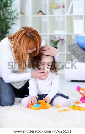 3 years old girl  and his mother - flu season